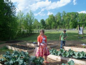 Girl watering a garden