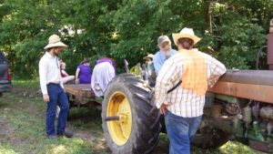 Farm workers and tractor