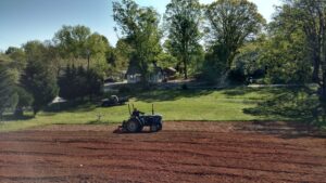 farmer plowing field