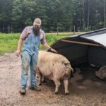 Farmer with pig