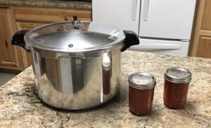 canner on counter with two jars