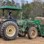 Skyler unloading a hay donation.